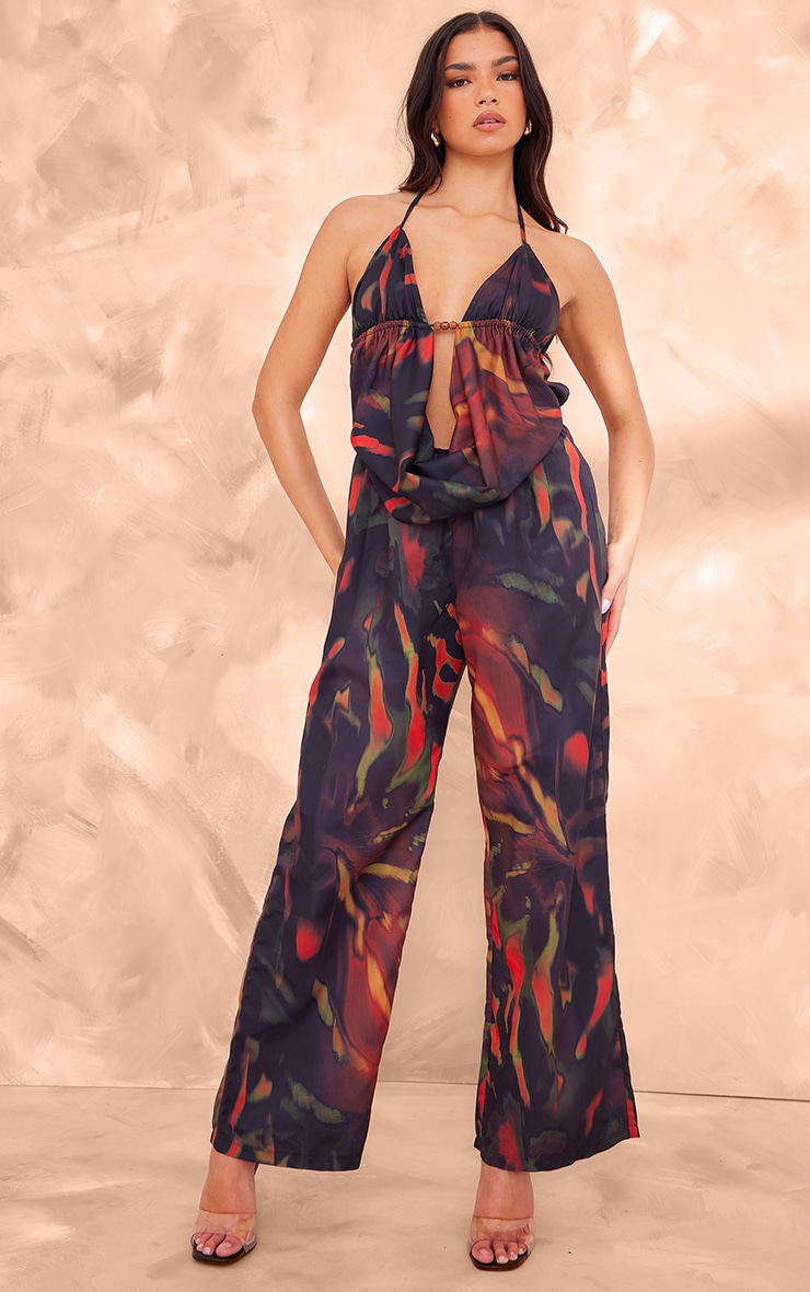 Black Leaf Printed Cowel Detail Halter Neck Jumpsuit 1 Black Leaf Printed Cowel Detail Halter Neck Jumpsuit