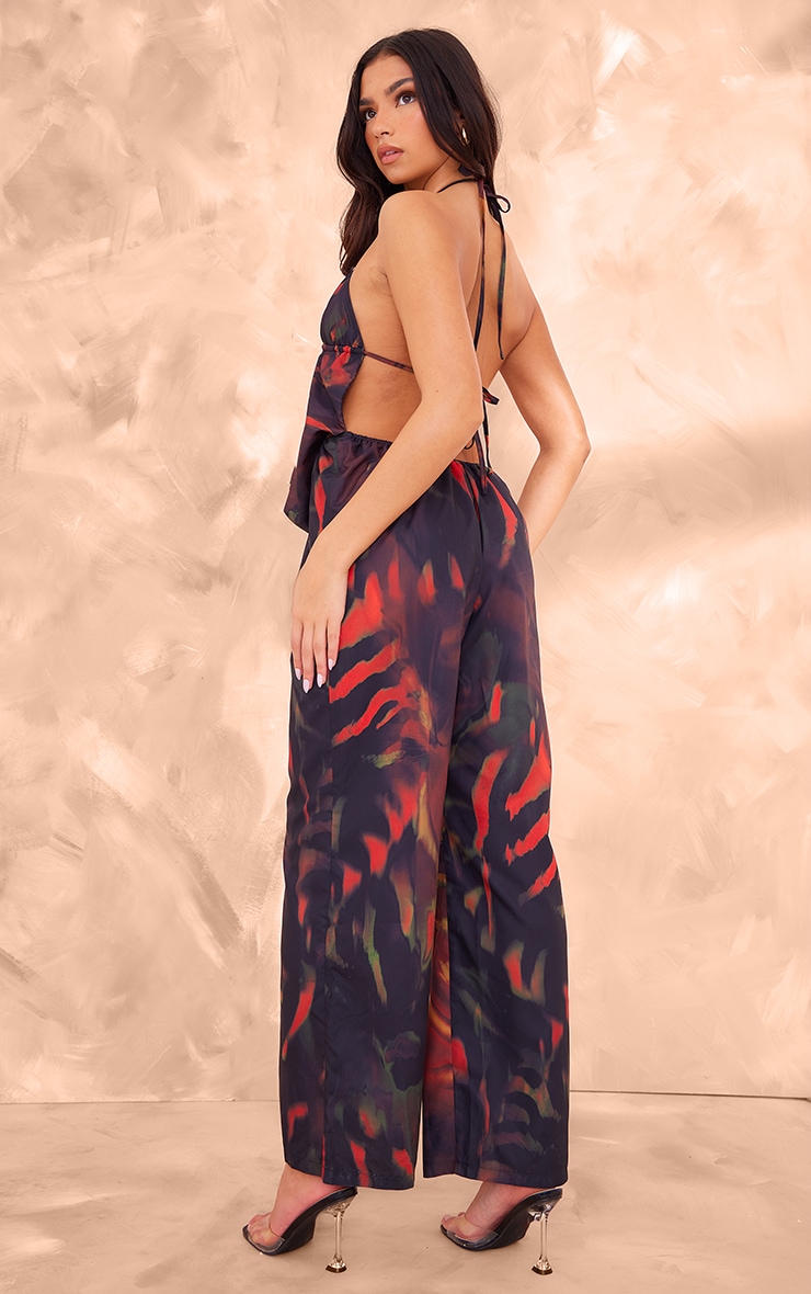 Black Leaf Printed Cowel Detail Halter Neck Jumpsuit 2 Black Leaf Printed Cowel Detail Halter Neck Jumpsuit