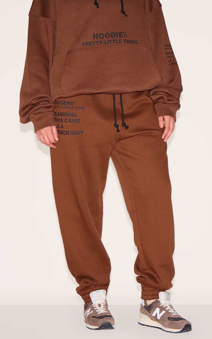 PRETTYLITTLETHING Plus Chocolate Slogan Print Joggers 2 PRETTYLITTLETHING Plus Chocolate Slogan Print Joggers